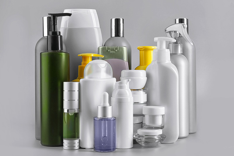 A set of personal care products on grey background